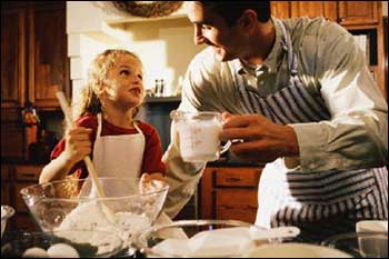 Father and daughter cooking