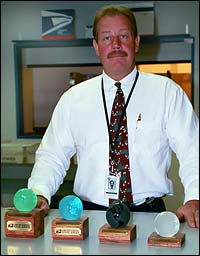 Postmaster Ralph Kaiser with  USPS Globe Awards