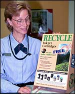 USPS employee with Recycling display