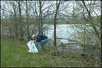 Collecting litter at river bank