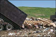 Unloading waste at landfill