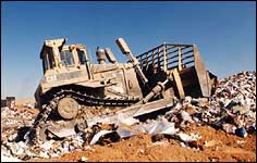 Dozer on waste at landfill