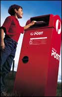 Boy posting letter