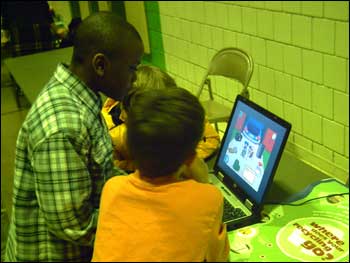 Kids looking at Ollie on computer at Minnesota fair